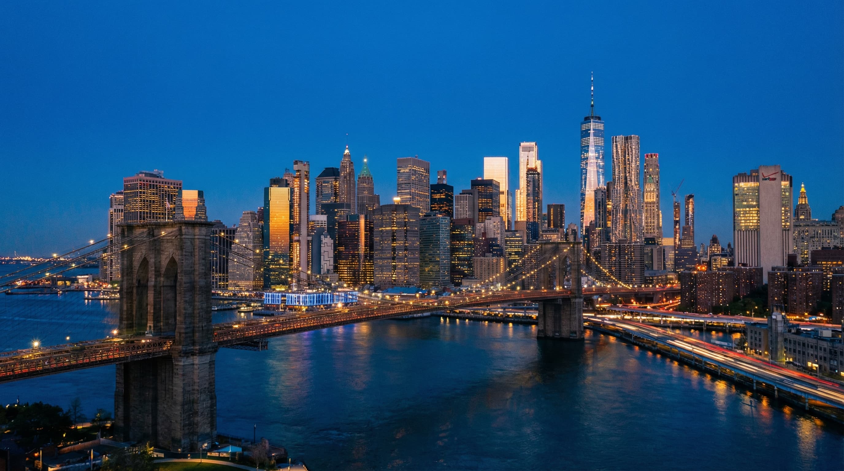 Brooklyn Bridge at twilight with Manhattan skyline